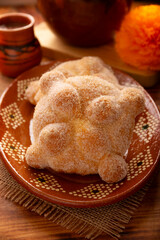 Pan de Muerto. Typical Mexican sweet bread that is consumed in the season of the day of the dead. It is a main element in the altars and offerings in the festivity of the day of the dead.