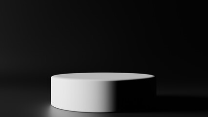 a white round object on a black surface