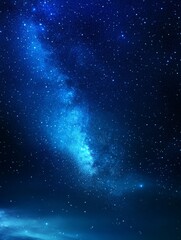 Fototapeta premium A stunning panoramic view of the Milky Way galaxy, showcasing a vibrant display of stars and cosmic dust against a deep blue night sky. This image captures the beauty and vastness of the universe, ins