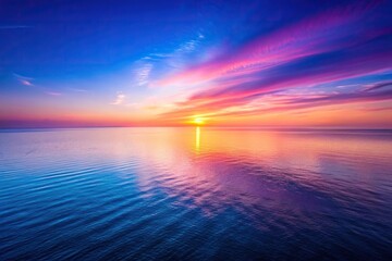 Obraz premium Aerial view of tranquil ocean sunset with pink and purple horizon
