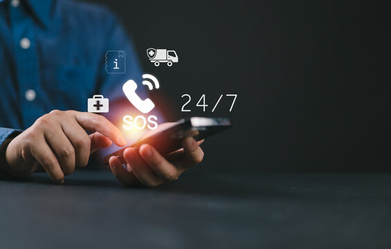 Hand touch button Emergency app in home, call phone, Chat message icon, Emergency application from smartphone for elderly, technology concept.Old hand touch mobile phone and call for help.