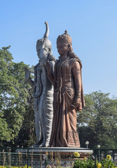 Fototapeta premium Big statue of Lord Sita Ram near Delhi International airport, Delhi, India, Lord Ram and Sita big statue touching sky at main highway Mahipalpur, Delhi