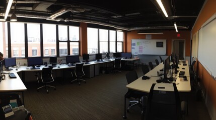 Modern Office Space with Computers and Bright Lighting