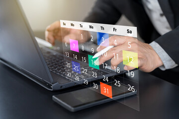 Time management concept. Businessman manages time for effective work. Calendar on the virtual screen interface.