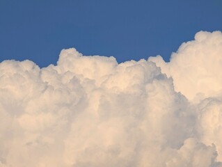 Cumulo form clouds with beautiful blue sky in horizon.