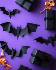 Halloween decoration with paper bats and gift boxes on purple backdrop