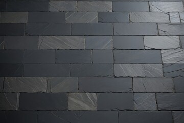 arafed black slate tiles are laid on a wall in a room