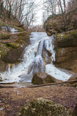 waterfall in winter, frozen streams of water and turned into ice blocks