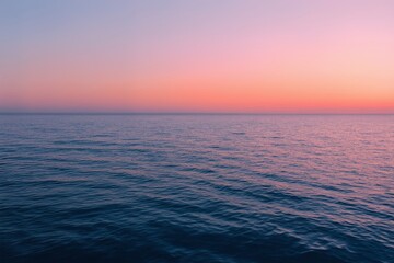 Obraz premium arafed view of a calm ocean at sunset with a boat in the distance