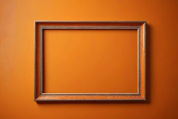 Fototapeta premium a close up of a picture frame on an orange wall