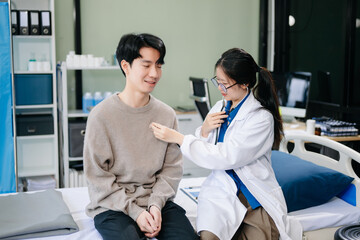 Doctor examining patient with symptoms in a clinic. Medical consultation and healthcare interaction.