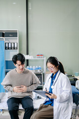 Obraz premium Doctor examining patient with symptoms in a clinic. Medical consultation and healthcare interaction.