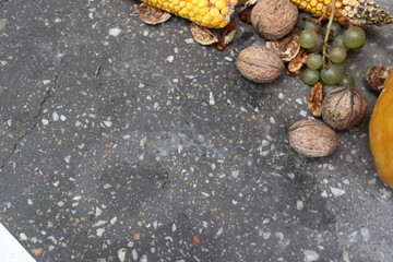 Autumn harvest elements on the concrete background