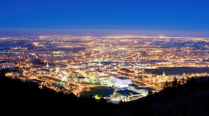 Obraz premium Cityscape at Night with Glowing Lights from Above