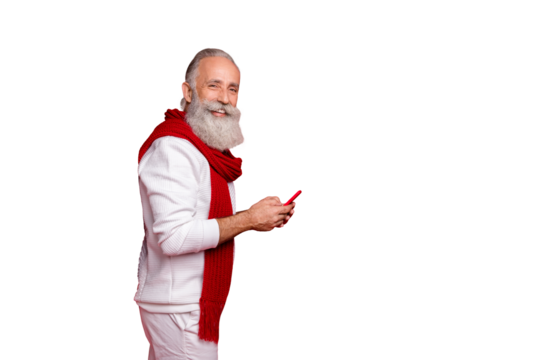 Trendy senior man order gifts in delivery website using smart phone wear knitted clothes isolated red background