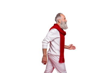 Hipster senior man plays cool stylish santa at corporate party wearing fashion knitted clothes isolated red background