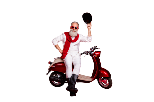 Aged macho man sit on retro moped greets every pretty lady street wear jumper and trousers isolated red background