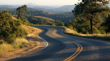 Naklejka premium Winding Road Through Scenic Mountain Landscape