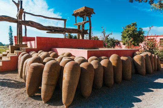 Old grape mill and clay still life for wine at Hacienda Tacama
