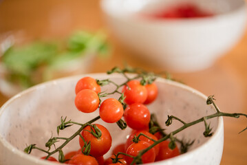 Close up of cherry tomatoes with vines