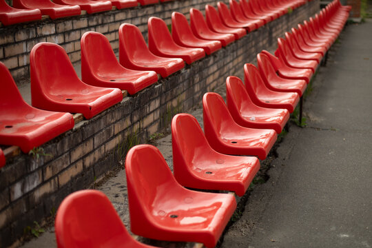 Sports stand. Empty seats in the stadium. Chairs in the stadium.