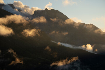 Clouds over mountain peaks of Picos de Europa national park, Spain