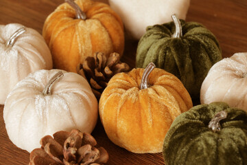 Velvet pumpkin decor, with pine cones. Fall autumn decorations.
