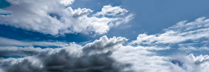 Banner Tropical summer blue sky fluffy white cloud summertime on light sunny day cloudscape. Panoramic Clear bright blue skyline spring sunlight climate background. Heaven blue ecology for web banner