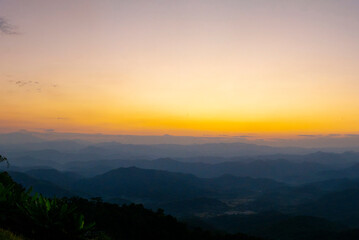 Scenic view dramatic beautiful sunset sky. Natural Sunset Sunrise on meadow silhouette shadow dark land. Vibrant dramatic sky on sunset, dawn, sunrise in Countryside. Landscape Colorful Sky At Sunset