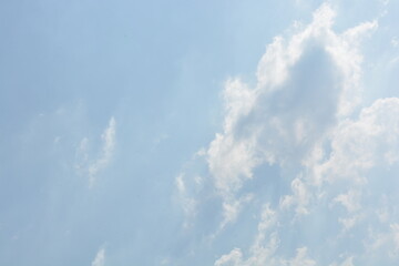 Dramatic white clouds with blue sky on sunny day