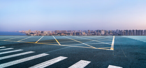 Modern Cityscape with Serene Coastal Horizon at Dusk