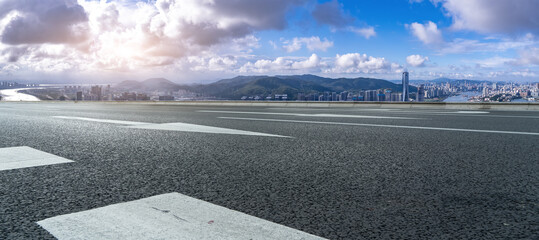 Panoramic View of Urban Landscape with Open Road and Mountains