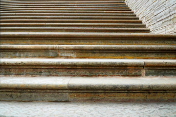 Steps in the sidewalk tile as a background .