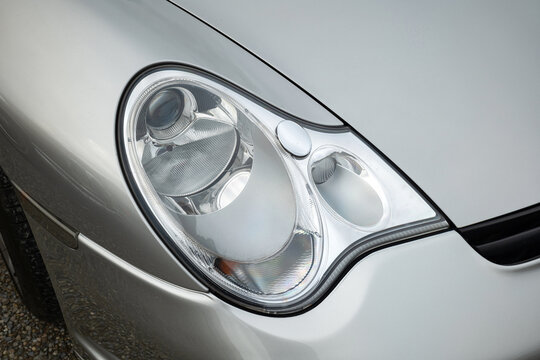 Porsche type 996 model 911 headlight or headlamp unit. Close up shot, top-down view, no people