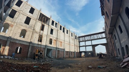 Under-Construction Building Site with Cement Mixer and Scaffolding