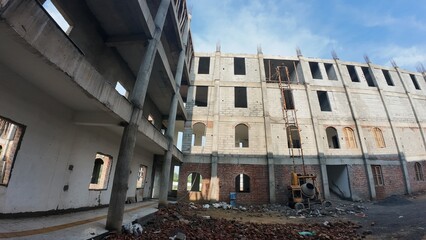 Under-Construction Building Site with Cement Mixer and Scaffolding