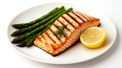 Grilled salmon fillet served with asparagus and lemon on a white plate.