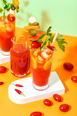 Spicy Bloody Mary cocktail with an aperitif of pickled vegetables on a skewer. Hot peppers, spicy food, spicy cocktails are the trend of the season. Pop-art vintage style