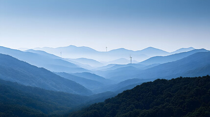 Serene Blue Mountain Range with Wind Turbines in the Distance, a Breathtaking Landscape Photo