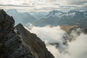 Majestic mountain landscape with clouds rolling over valleys during a serene morning hike