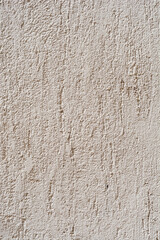 Detail of a beige painted exterior wall - background wallpaper