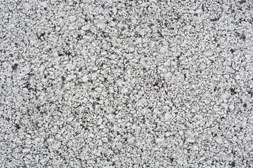 Detail of an asphalt road painted in white