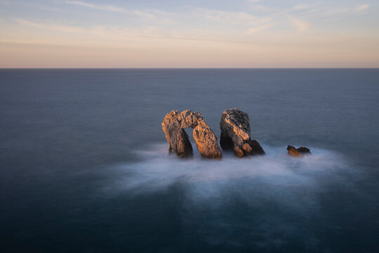 Urro del Manzano rock formation at sunset, Liencres, Spain