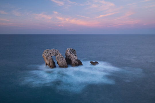 Urro del Manzano rock formation at sunset, Liencres, Spain