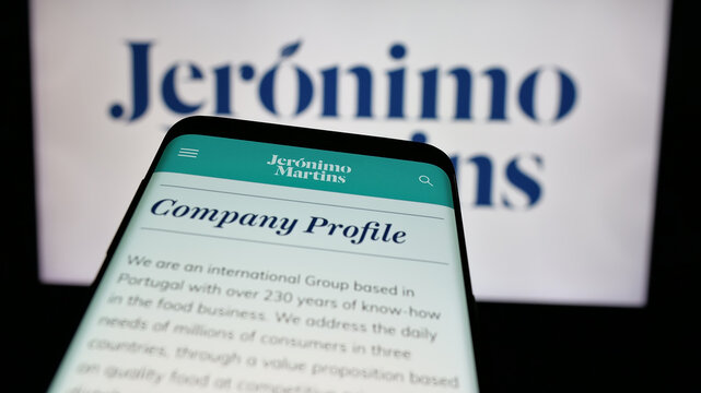 Stuttgart, Germany - 10-01-2024: Mobile phone with website of retail company Jeronimo Martins SGPS S.A. on screen in front of business logo. Focus on top-left of phone display.