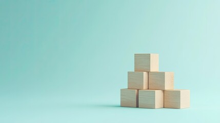 Stacked wooden blocks arranged as steps on a light blue background, representing growth and progress in business. Minimalist design with plenty of copy space.
