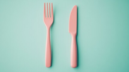 Two pink plastic utensils, a fork and a knife