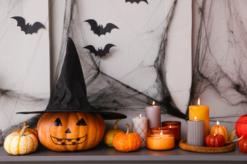 Fireplace with different Halloween decor indoors. Festive interior
