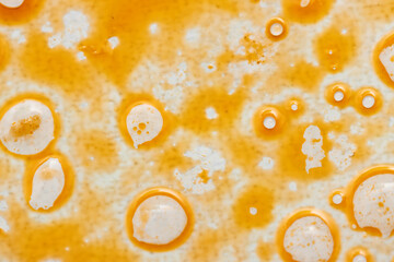 greasy round spots on white background.