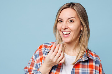Close up young smiling happy woman she wears red shirt t-shirt casual clothes hold in hands...